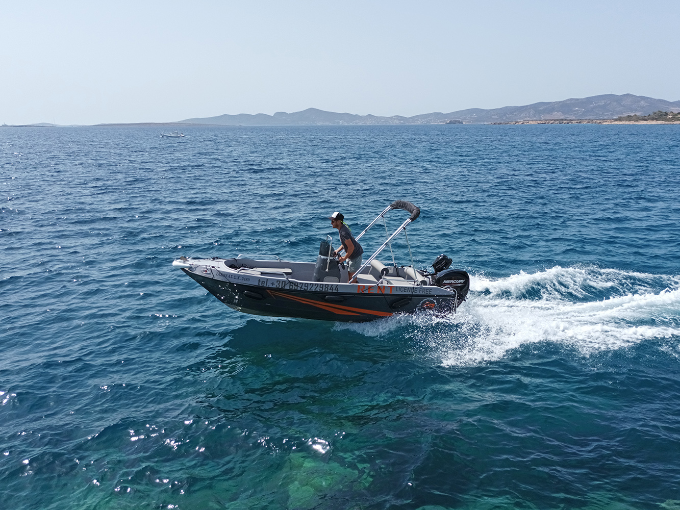 Experience Paros' coastline by boat - a must-do activity